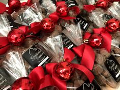 chocolate candies wrapped in cellophane and tied with red ribbon are on display