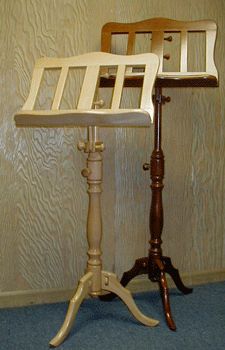 a wooden chair sitting on top of a table next to a blue carpeted floor