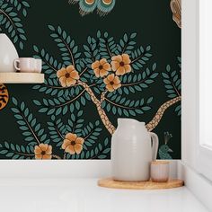 the wallpaper in this kitchen is painted with birds and flowers on it, along with two vases