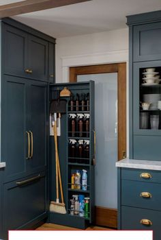 an open cabinet in a kitchen with blue cabinets and white counter tops, filled with cleaning supplies