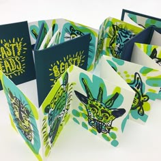 several folded greeting cards with designs on them