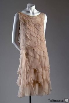 1920s DRESS (1925).  Evening dress. Designed by Gabrielle "Coco" Chanel. French. Pink crepe chiffon.  From http://fashionmuseum.fitnyc.edu/view/objects/asitem/761/87/dynasty-desc?t%3Astate%3Aflow=57dc4289-fe01-4d65-a9c3-dfcb6a579700 Dress Chanel, Chanel Dress, 20th Century Fashion