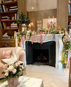 a living room filled with furniture and a fire place covered in pink ribboned bows