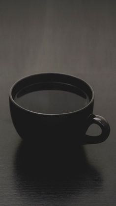 a black bowl sitting on top of a table