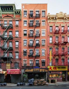 an apartment building with fire escapes in the front