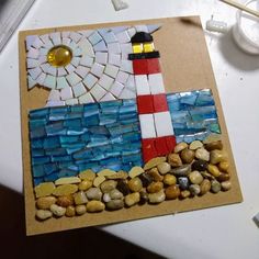 a piece of art made out of glass and pebbles