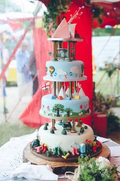 a three tiered cake on top of a table