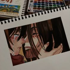 a drawing of two people with their faces close to each other next to colored pencils