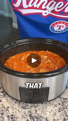 a crock pot filled with food sitting on top of a counter