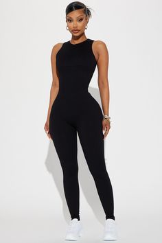 Available In Black, Charcoal, And Sand. Active Jumpsuit Seamless Ribbed Crew Neck Sleeveless Back Cut Out Skinny Leg Stretch 92% Nylon 8% Elastane Imported | Effortless Kim Ribbed Seamless Jumpsuit in Black size Large by Fashion Nova Black Sleeveless Bodysuit For Loungewear, Black Stretch Jumpsuits And Rompers With Seamless Construction, High Stretch Sleeveless Bodysuit In Solid Color, Sleeveless Bodycon Bodysuit For Loungewear, Sleeveless High Stretch Solid Color Bodysuit, High Stretch Sleeveless Solid Color Bodysuit, Sleeveless Ribbed Bodysuit For Workout, Black High Stretch Seamless Jumpsuits And Rompers, Black Ribbed High Stretch Bodysuit