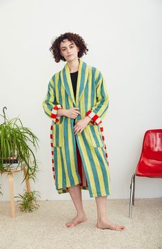 Designer Ellen Van Dusen doubles down on her love of stripes with this cotton-terry robe playfully patterned with a contrasting interior colorway and tie. 46" length (size Medium) Shawl collar Front patch pockets Removable tie belt 100% cotton Machine wash, tumble dry Made in Portugal Winter Robes, Cotton Bathrobe, Dusen Dusen, Terry Robe, Winter Pajamas, Diy Kits Gift, Brushed Cotton, Shawl Collar, Green Stripes