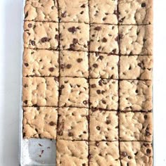 a pan filled with cookies on top of a white table