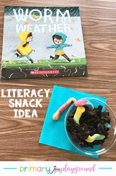 a book and some food on top of a wooden table with the title worm's weather