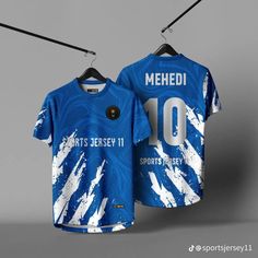 a blue jersey with white paint splattered on it and the number 10 is hanging from