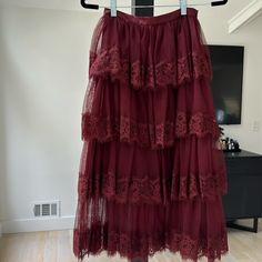 Mesh And Lace Layered Skirt In A Beautiful Burgundy Color. Red Ruffled Full Skirt, Red Full Skirt With Ruffles, Red Full Ruffled Skirt, Burgundy Lined Skirt, Elegant Red Tiered Skirt, Party Burgundy Skirt, Spring Party Skirt In Burgundy, Red Midi Skirt, Ruffle Maxi Skirt