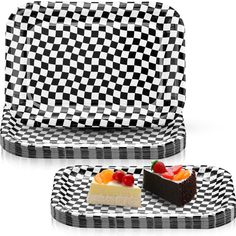 two pieces of cake sitting on top of checkered trays next to each other