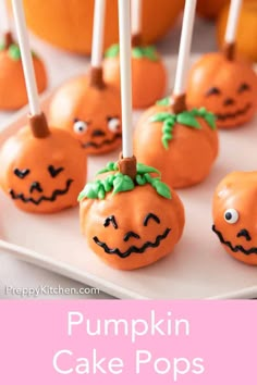 pumpkin cake pops on a plate with candy sticks