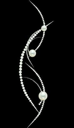 a white pearl and diamond necklace on a black background