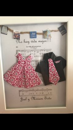 a frame with some clothes hanging from it's sides and music notes on the wall