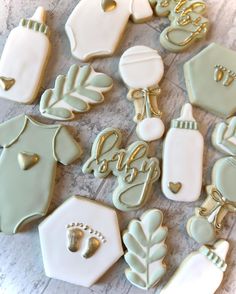 baby shower cookies decorated with gold and white icing