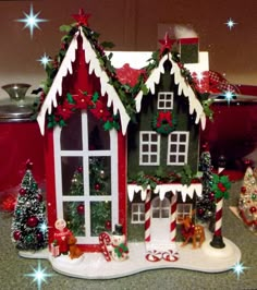 a gingerbread house decorated with christmas decorations