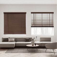 a modern living room with white walls and wooden blinds