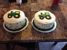 two cakes decorated with green and yellow tractors