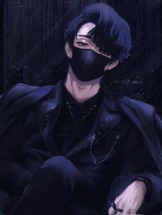 a man wearing a black mask sitting in the rain