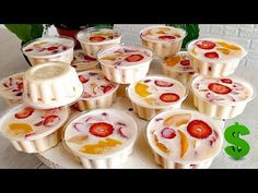 there are many dessert cups with strawberries on them