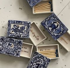 matchboxes with blue and white designs are arranged in the shape of an eagle