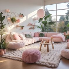 a living room filled with lots of pink couches and pillows on top of a rug