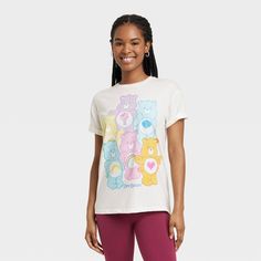 Step out in style with the Women's Care Bears Short Sleeve Graphic T-Shirt - Off-White. Made from soft material with a crew neck and short sleeves, this t-shirt keeps you cool and relaxed. It has a colorful Care Bears graphic print to add a fun touch. Express your unique style with the Women's Care Bears Short Sleeve Graphic T-Shirt - Off-White. Playful Crew Neck T-shirt For Loungewear, White Pre-shrunk T-shirt For Loungewear, Trendy Short Sleeve T-shirt For Loungewear, Playful Short Sleeve T-shirt For Streetwear, Cute White Short Sleeve T-shirt, Playful Short Sleeve Loungewear Top, Playful Short Sleeve Top For Loungewear, Playful Relaxed Fit T-shirt For Loungewear, Cute Short Sleeve T-shirt For Loungewear