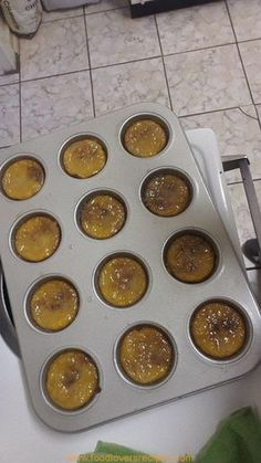 a muffin pan filled with cupcakes on top of a counter