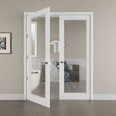 an open door leading to a bathroom with tiled flooring