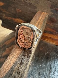 Unleash your inner adventurer with our stunning handcrafted steampunk ring, a perfect fusion of vintage charm and industrial design. Each ring is meticulously crafted, showcasing intricate gears and whimsical details that make it a standout piece for any jewelry collection. ✨ Features: Artisan Craftsmanship: Handcrafted with care, ensuring every piece is one-of-a-kind. Quality Materials: Made from durable materials, combining style and longevity for everyday wear. Comfortable Fit: Designed for b Steampunk Ring, Steampunk Rings, Jewelry Unique, Ring Vintage, Vintage Charms, Rings Statement, Industrial Design, Vintage Rings, Statement Pieces