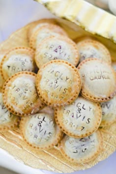 small crackers with writing on them sitting on a plate