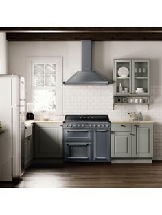 an image of a kitchen setting with stove, refrigerator and oven in it's center