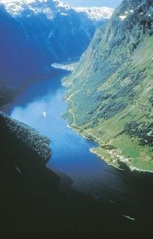 an aerial view of a river and mountains