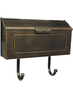 an old fashioned mailbox is hanging on a metal rack with two handles and a door handle