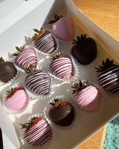 chocolate covered strawberries in a white box on a table