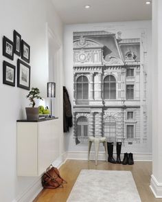 the hallway is decorated with black and white wallpaper