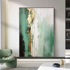 an abstract painting hangs on the wall in a modern living room