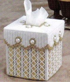 a white tissue box sitting on top of a table