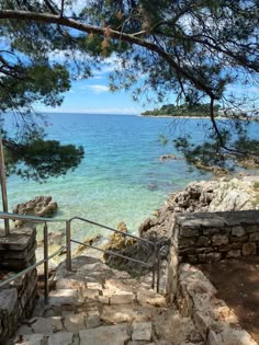 Photo of stone stairs leading down to the ocean, with crystal clear Turquoise water on a warm, sunny summers day in Croatia. Croatia Vacation, Summer Abroad, Croatia Beach