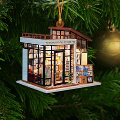 a book store ornament hanging from a christmas tree