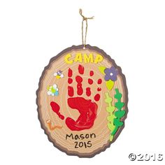 a wooden ornament with a handprint on it that says camp mason 2013