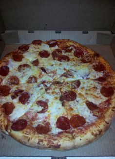 a large pepperoni pizza in a box