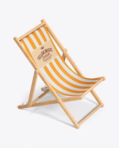 an orange and white striped beach chair