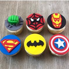 six cupcakes decorated to look like superheros