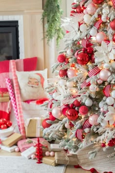 a decorated christmas tree with red and white ornaments